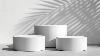 Round White Pedestals with Shadow Play, Artistic Display, Minimalist, Creative, Modern, Chic, Elegant, Sophisticated, Decorative, Clean, Simple, Stylish, Unique, Versatile, Serene, Balanced, Composed,