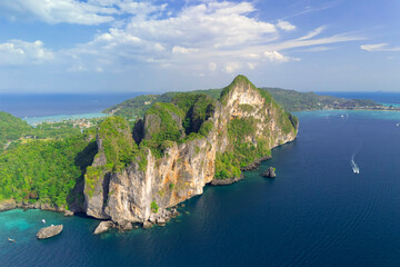 Magical paradise islands with rocks jungle forest on the coast of atoll coral reefs in Andaman Sea view Krabi from above aerial top view drone travel
