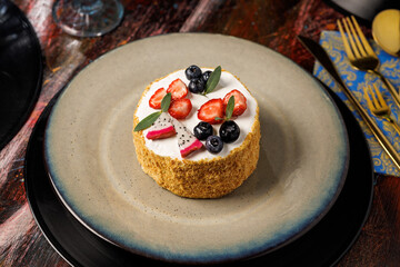 Mini cheesecake with fresh berries on plate