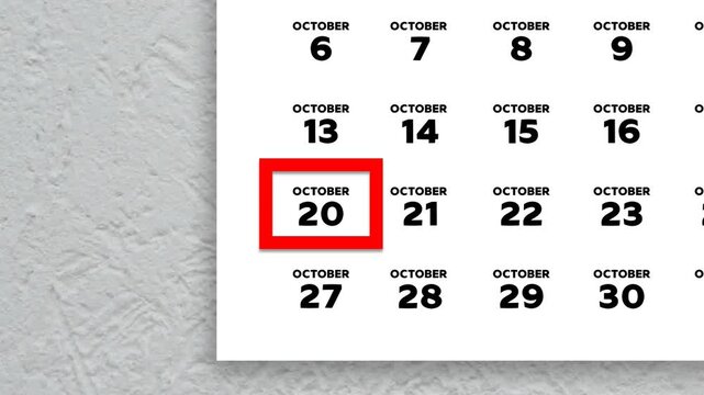 The date October 20th marked with a red cursor on the wall calendar 2025
