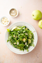 Arugula salad with green apple and almond flakes