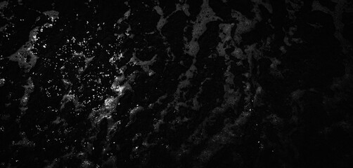 black foamy water surface