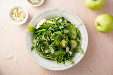 Arugula salad with green apple and almond flakes