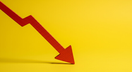 A red arrow pointing downwards diagonally on a yellow background indicating a negative trend or decline