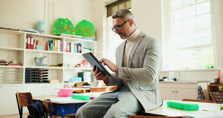 Obraz na płótnie Canvas Reading, tablet and education with teacher in classroom for digital exam, support and report results. Learning, scroll and online test grading with man in school for child development and growth