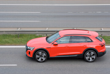 Side View of Fully Electric Luxury Family SUV In Motion