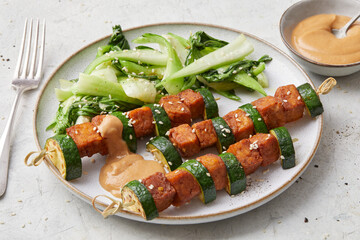 Tempeh skewers with peanut sauce
