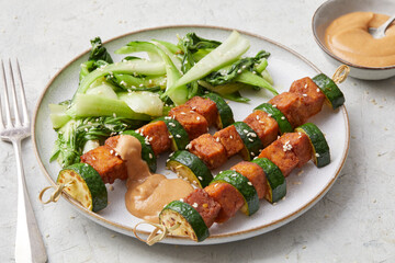 Tempeh skewers with peanut sauce