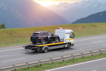 Bran New Family SUV Car On Tow Truck Flatbed From Dealership To Customer