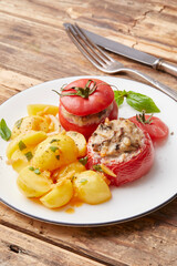 Stuffed tomatoes with potato fritters