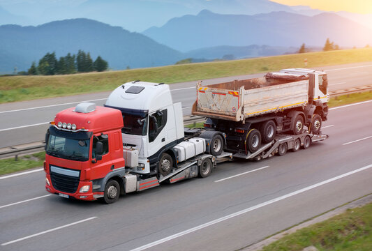 Heavy-Duty Vehicle Transporting Two Semi-Trailer Trucks
