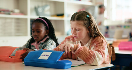 Stationery, box or girls in classroom for learning education, test paper or solution with students. Creative, quiz or smart kids at school for child development, assessment or knowledge evaluation