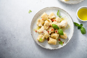 Homemade potato gnocchi with basil and chilli