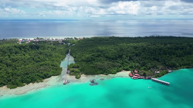 Maratua, Indonesia: Aerial drone footage of the famous Maratua lagoon and island in the Derawan Archipelago in Borneo Indonesia. Shot with orbit motion