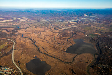 Aerial view. Golden autumn in Primorsky Krai. The Sikhote-Alin mountain range from above.