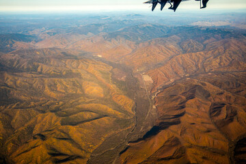 Aerial view. Golden autumn in Primorsky Krai. The Sikhote-Alin mountain range from above.