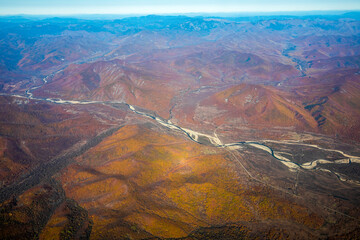 Aerial view. Golden autumn in Primorsky Krai. The Sikhote-Alin mountain range from above.