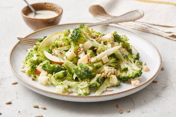 Raw salad with broccoli and apple