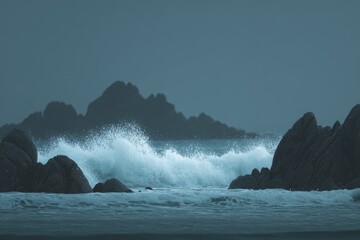Stormy sea crashing against rocks, moody landscape