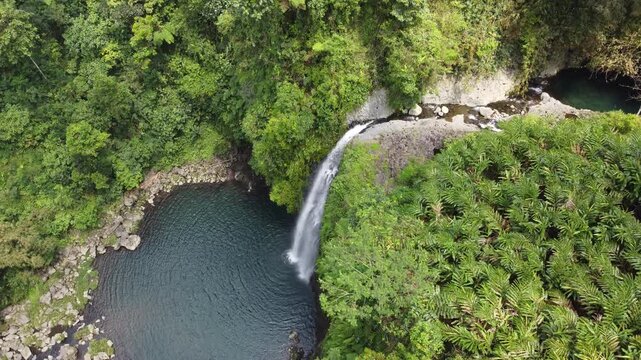Gede Waterfall, captured on September 3, 2025. Scenic tropical waterfall flowing between green cliffs and dense forest, natural Indonesian landscape with refreshing atmosphere