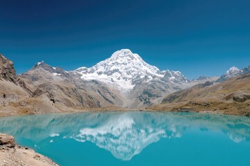Obraz premium Majestic mountain peak reflected in a turquoise lake