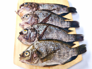 A Stack of Tilapia Fish on a Clean White Background