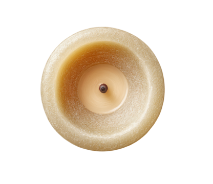 Overhead view of a light beige candle.  Round, textured wax; small wick