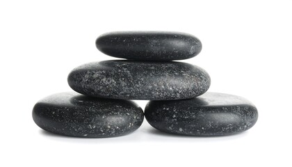 Stacked dark stones on white background