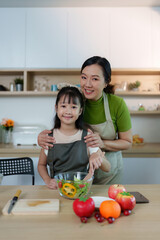 Cooking Together. Mother and daughter creating healthy meals in a bright kitchen.