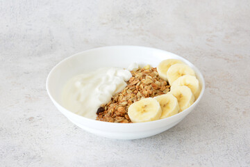 Healthy Breakfast Bowl with Yogurt, Granola and Banana Slices cut out