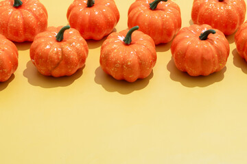Autumn pumpkins pattern on orange background