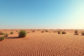 Obraz premium Vast desert expanse under a clear blue sky. Sparse vegetation dotted across a rippled sandy plain