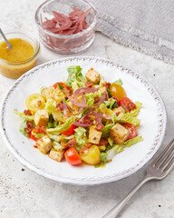 Tofu salad with mustard dressing and cherry tomatoes