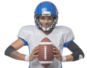 A football player in a blue helmet and white jersey confidently holds a brown football, showcasing determination and readiness.