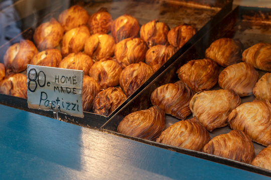 Delicious Maltese pastizzi filled with ricotta and peas, on sale at a stall in the historic centre of Valletta, Malta