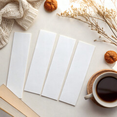 Four White Bookmark Mockups with Coffee, Dried Flowers and Knitted Sweater on Light Cozy Background