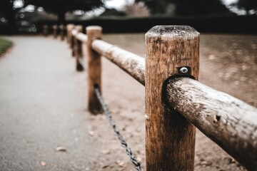 Wooden fence line along a path
