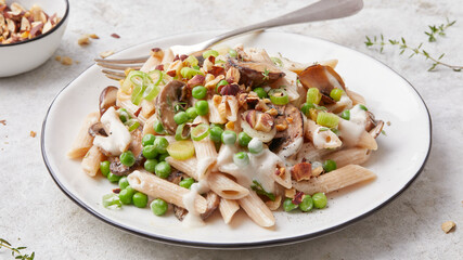 Pasta with peas and hazelnuts