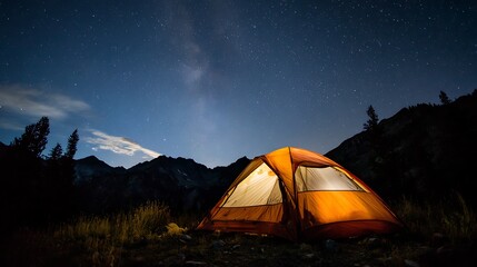 Cozy tent glowing under a starry night sky, with mountain silhouettes in the background.