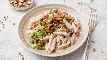 Pasta with peas and hazelnuts