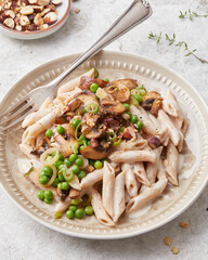 Pasta with peas and hazelnuts