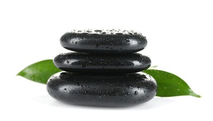 Fototapeta premium Stacked stones with leaves