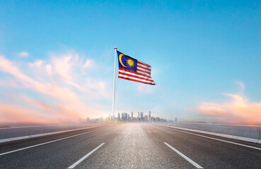 Malaysia national flag with mast waving with beautiful skyline. A view from highway. Malaysia flag...
