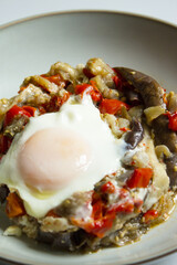 Cooked vegetables with poached egg