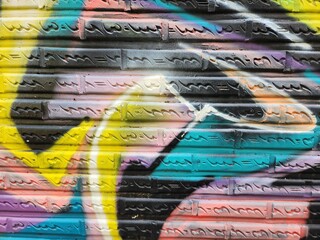Graffiti wall, graffiti texture, graffiti graphics on bricks, graffiti background, simple wall