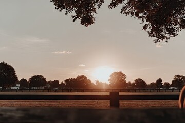 Golden sunset over a polo field
