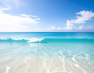Obraz premium Crystal clear turquoise ocean water with gentle waves on a white sand beach under a blue sky