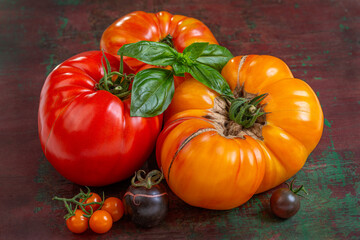 Fresh tomatoes on wooden background