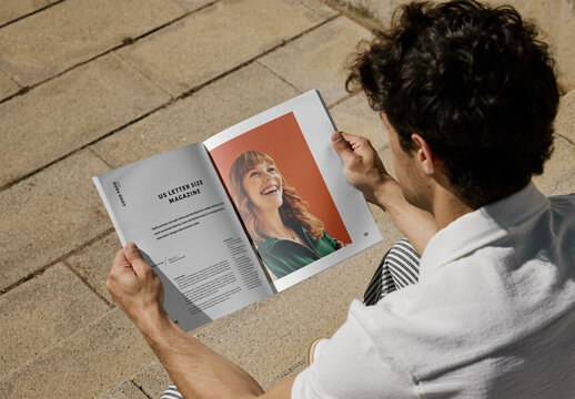 Mockup Of Man Reading Customizable Us Letter Magazine