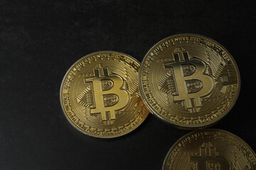 bitcoin gold, money on black background
